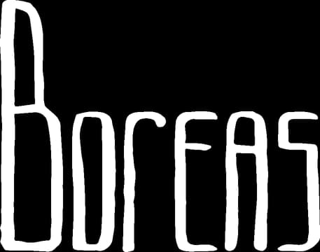 Tall, narrow white font with uneven lines, slightly distorted letters.