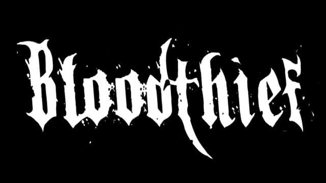 Gothic font with splatter effect, exaggerated sharp edges and flourishes.