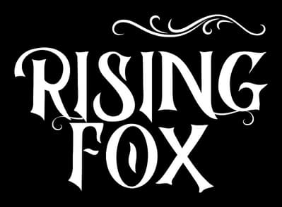 Rising Fox: Ornate serif lettering with curled flourishes and distressed edges.