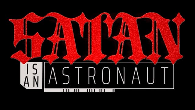 Red ornate gothic font with white bold sans-serif text beneath.