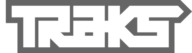 Traks: Bold blocky geometric letters with sharp corners and angular cutouts.