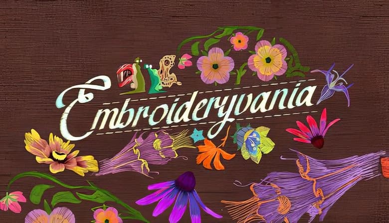 Embroideryvania: Colorful embroidered flowers and two slugs with vibrant shells on textured brown fabric backdrop.