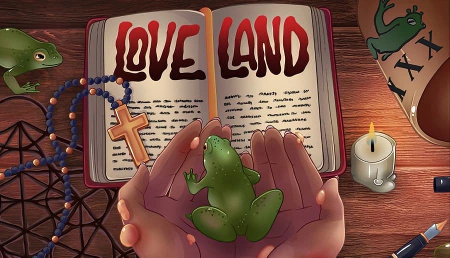 Loveland: Hands hold green frogs over an open book beside rosary and pentagram, candlelit wooden table scene.