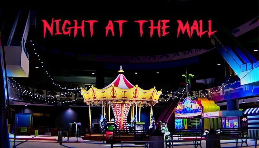 Night At The Mall: Empty shopping mall with a glowing carousel and colorful arcade, under a ceiling of hanging lights.