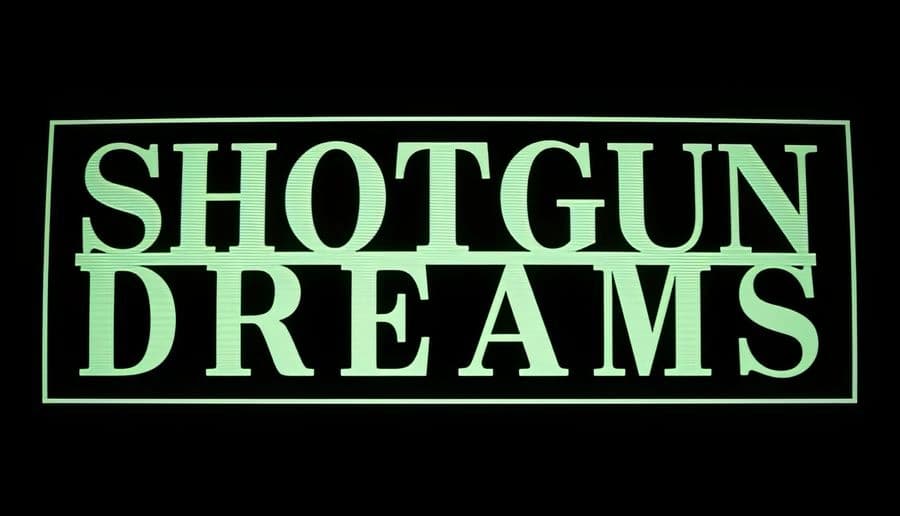 SHOTGUN DREAMS: Large mint-green title on black background inside a thin rectangular border Minimalist logo screen.
