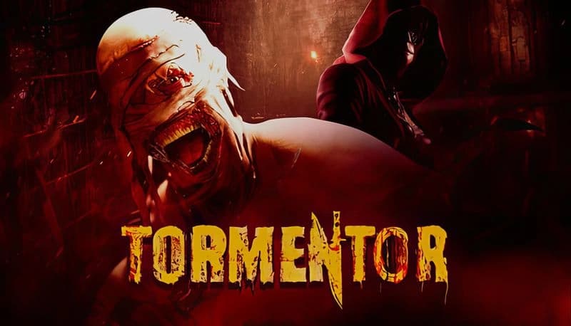 TORMENTOR: Bandaged monster with gaping mouth confronts hooded figure in dark, sinister room with ominous red lighting.
