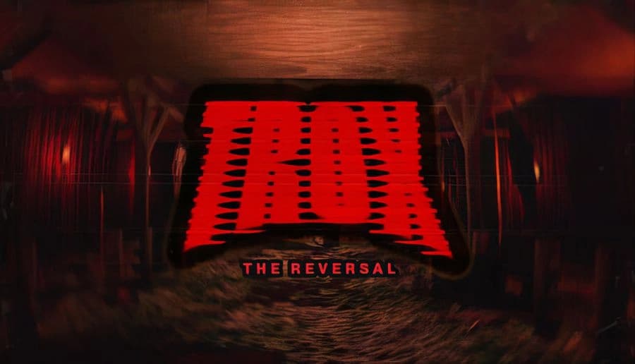 TROX-THE REVERSAL: Red logo over a dark, blurred tunnel with distorted lighting, creating an unsettling atmosphere.