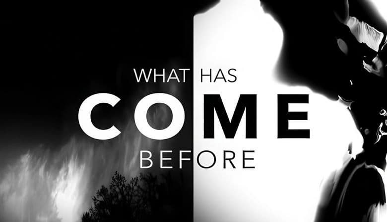 What Has Come Before: Monochrome scene split by dark and light, silhouetted figure on right, eerie landscape on left.