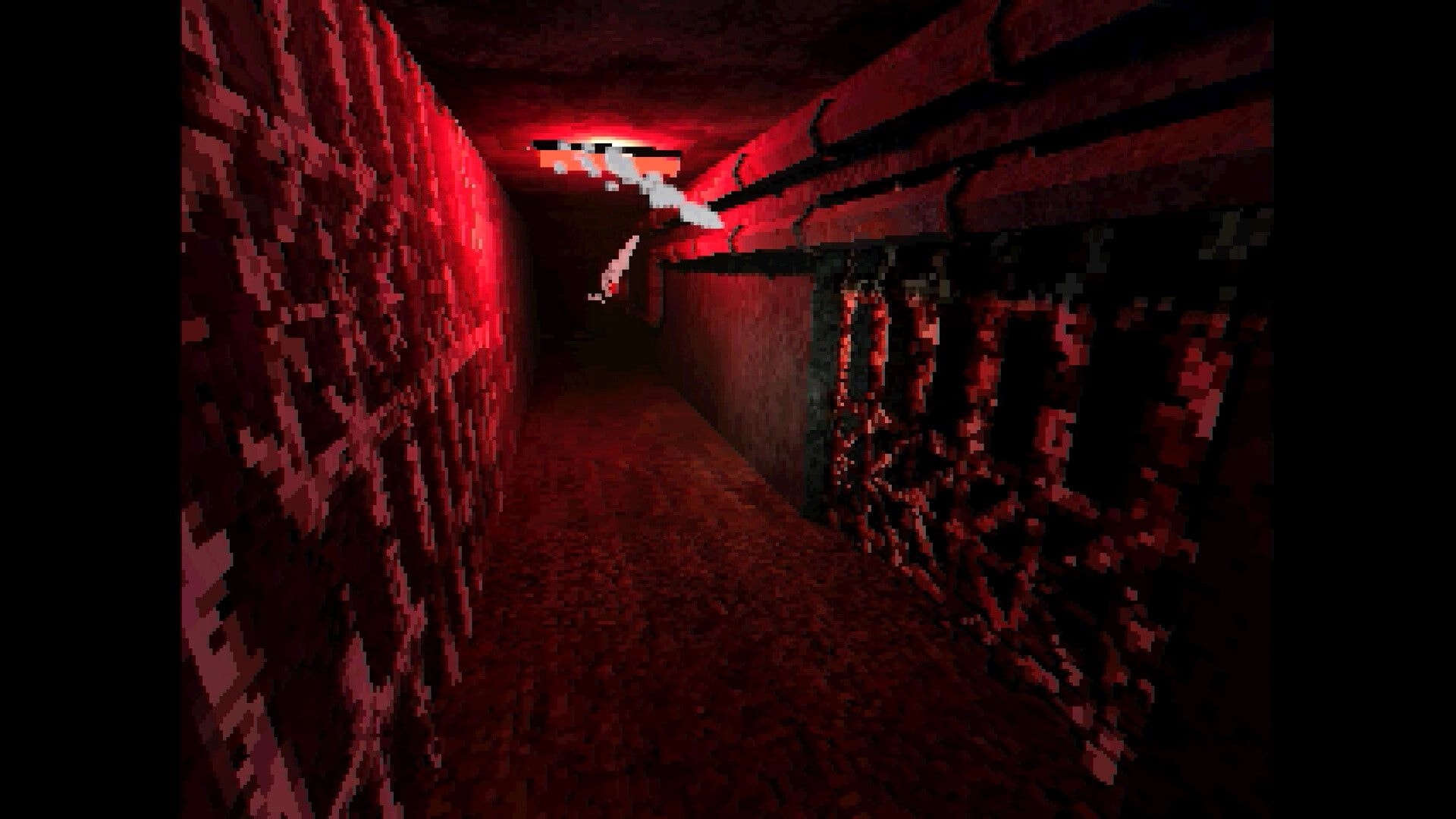 Arctic Grave: First-person view down a red-lit corridor with pipes overhead and a barred gate wall.
