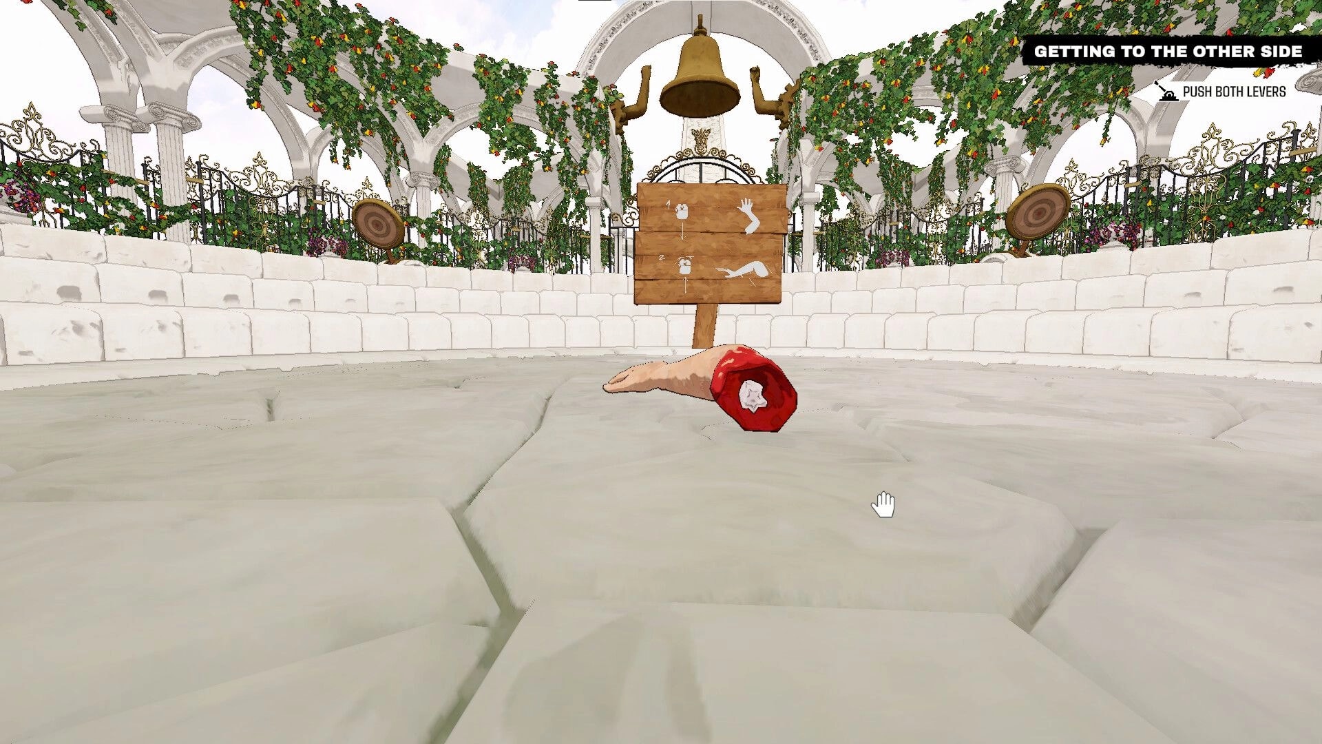 Arm Around!: Disembodied arm on stone floor in garden setting with instruction sign and bell in background