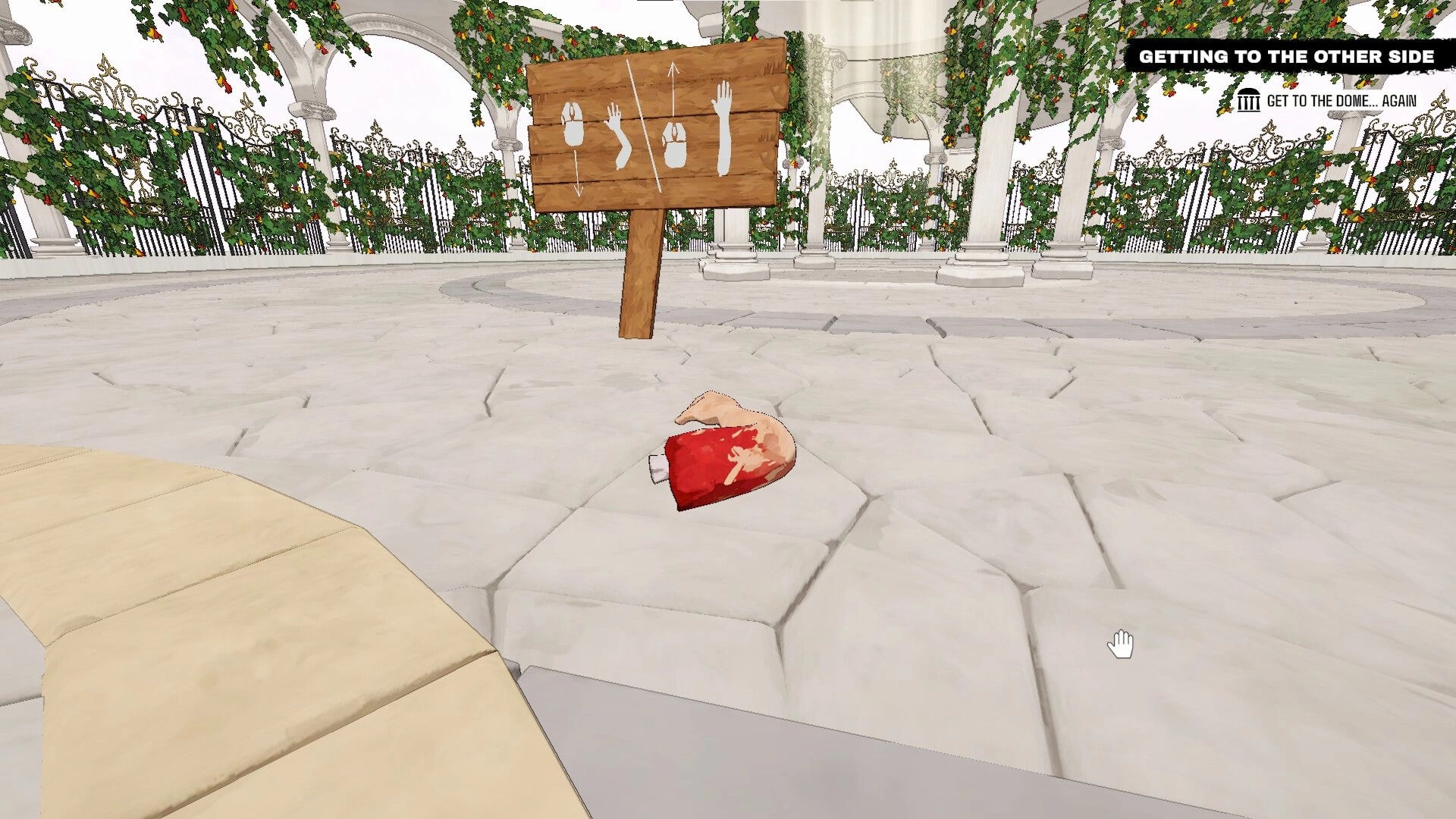 Arm Around!: Severed arm on stone path near wooden sign with controls, surrounded by vine-covered arches.