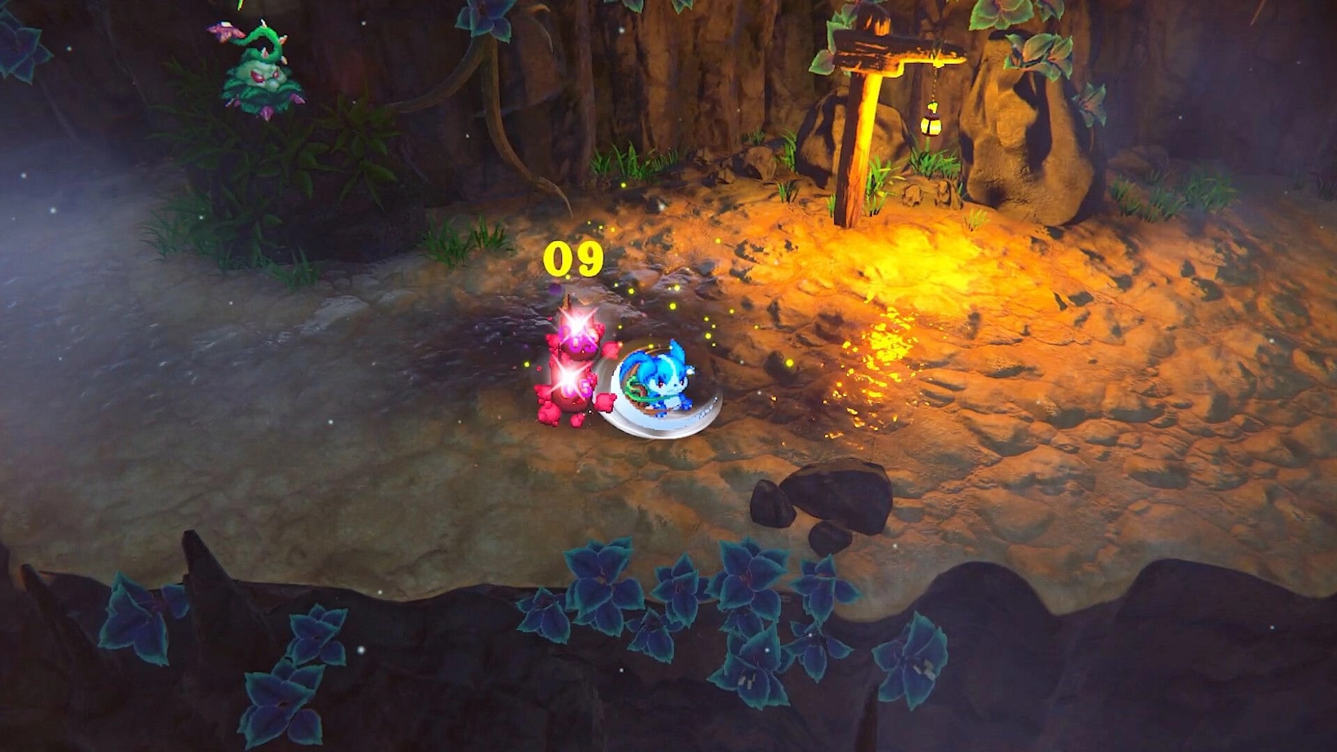 EDEN’S FRONTIER™: Bluveil strikes a red foe for 0.9 damage in a rocky cave lit by a lantern.