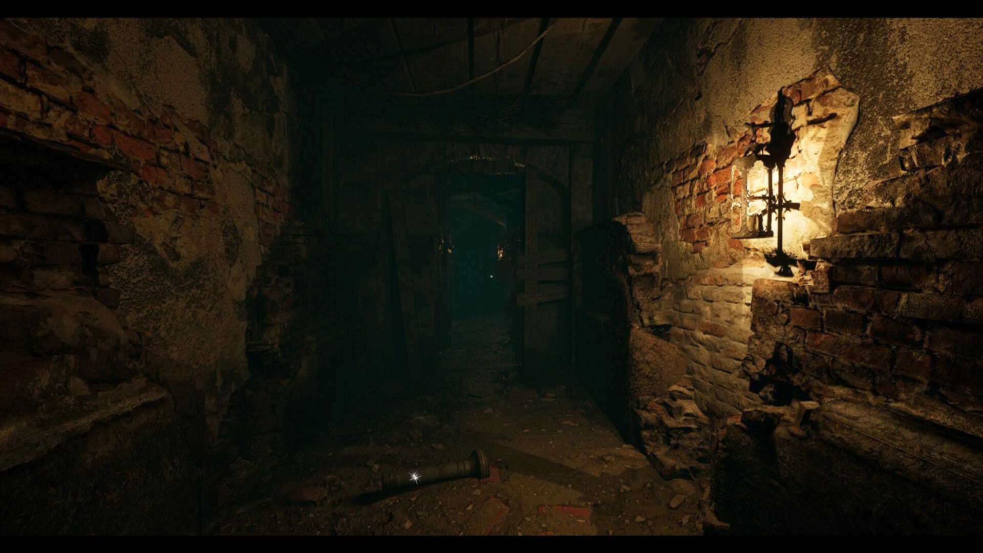 Edge Of Evil: Dimly lit crypt hallway with flashlight on ground and lanterns illuminating brick walls