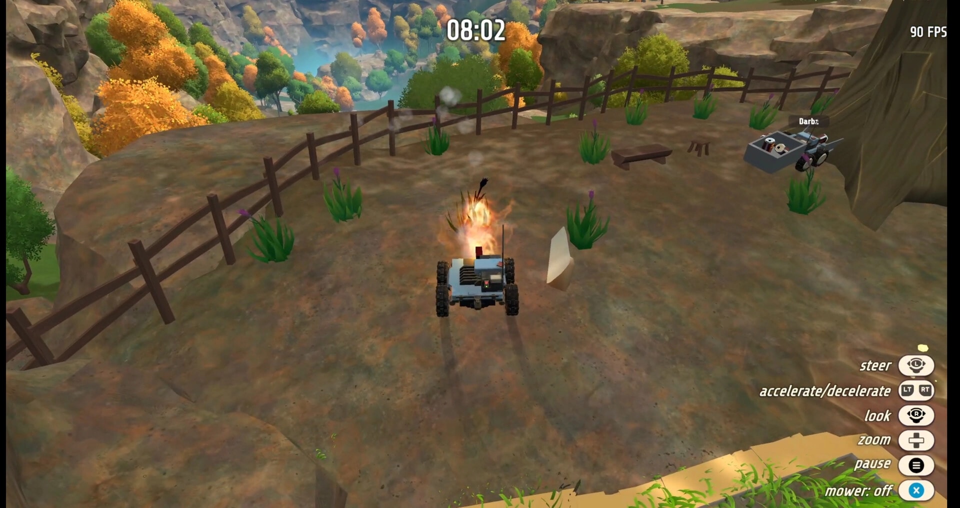 Grass: Player drives a smoking mower near grass tufts and tool cart on a fenced cliffside yard UI timer 08:02.