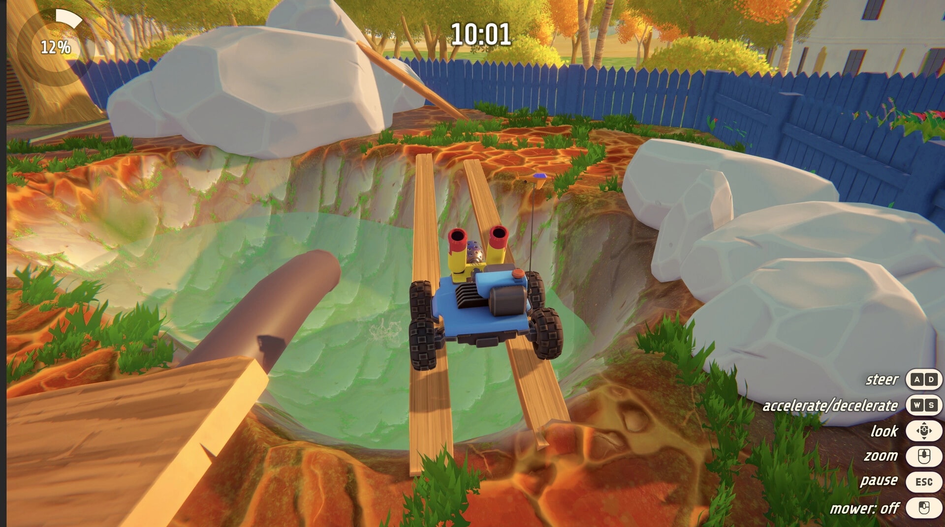 Grass: Remote mower crossing planks over a pit in fenced yard, with timer and controls HUD visible.
