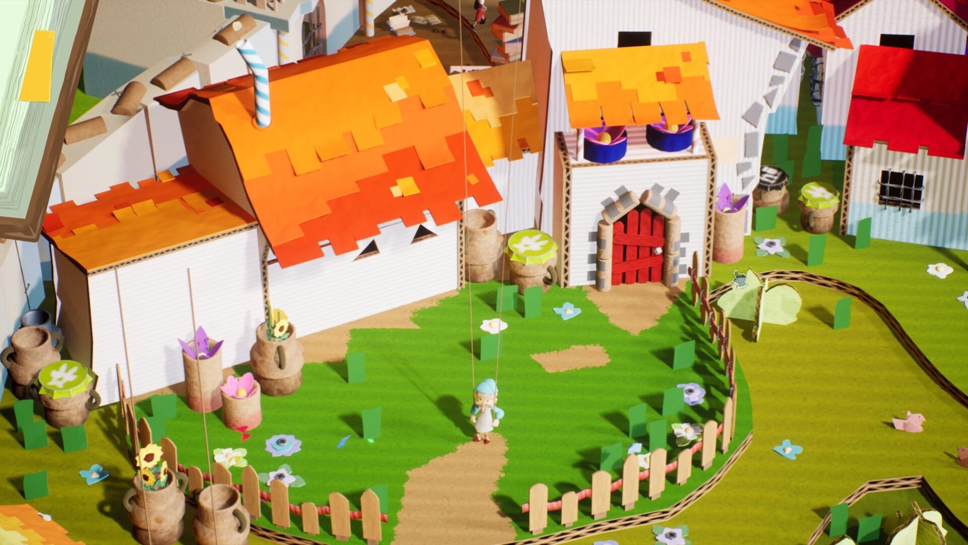 Hidalgo: Puppet character stands on a dirt path outside red-doored houses in a paper village yard.