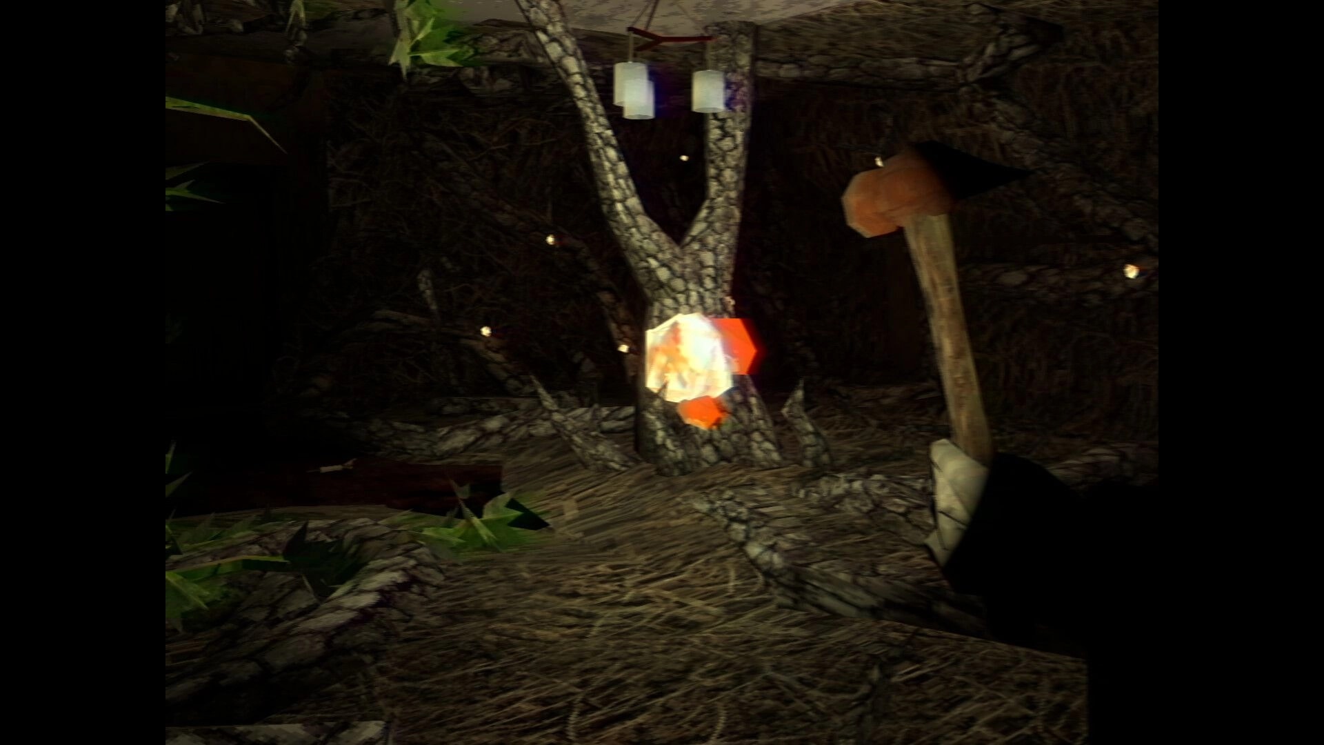 It Breathes: First-person view holding a hammer in a dim cave with hanging lanterns and a glowing crystal.