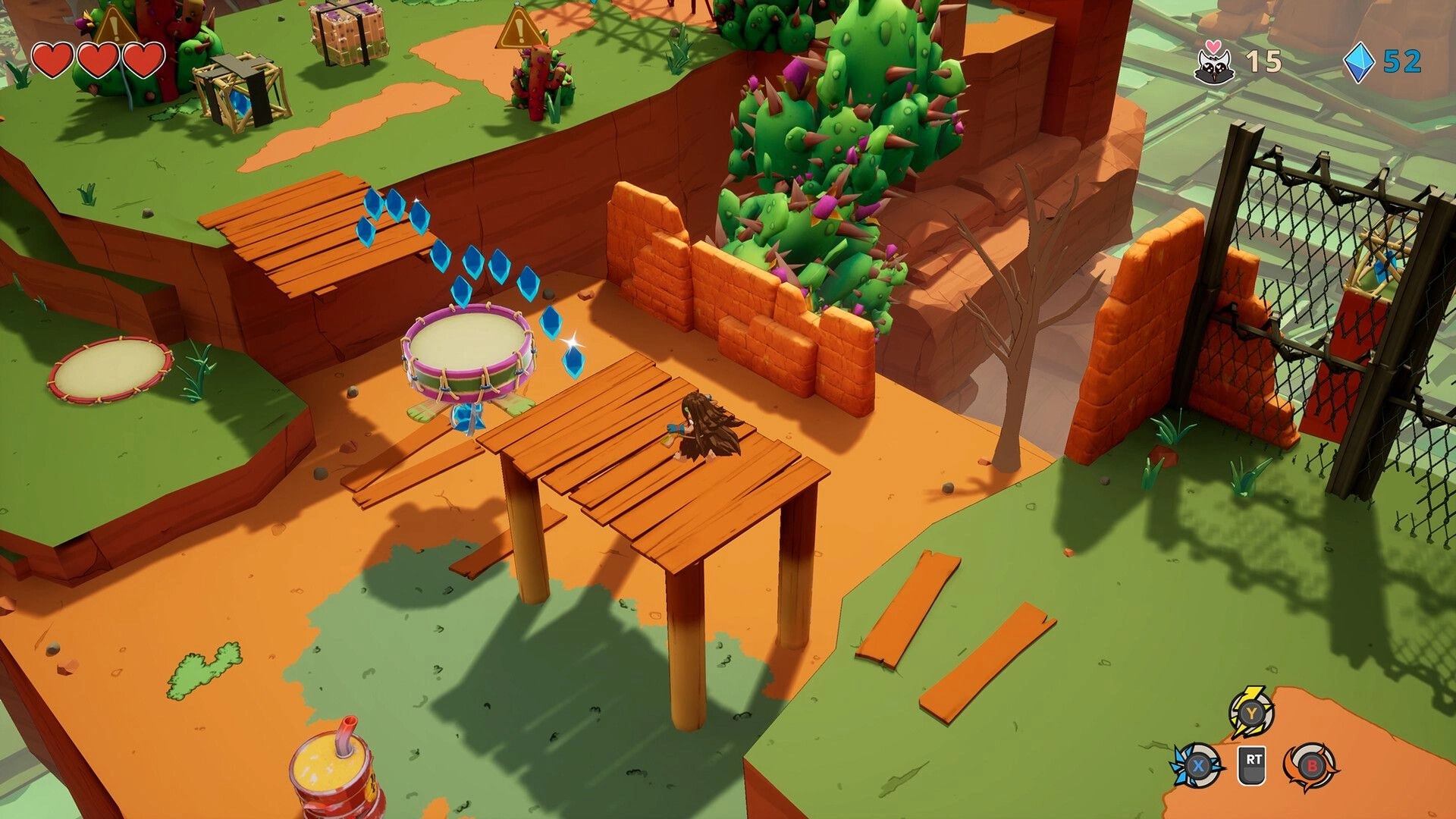 Kalanoro: Player runs across wooden platforms collecting blue gems in a canyon with cactus and gate.