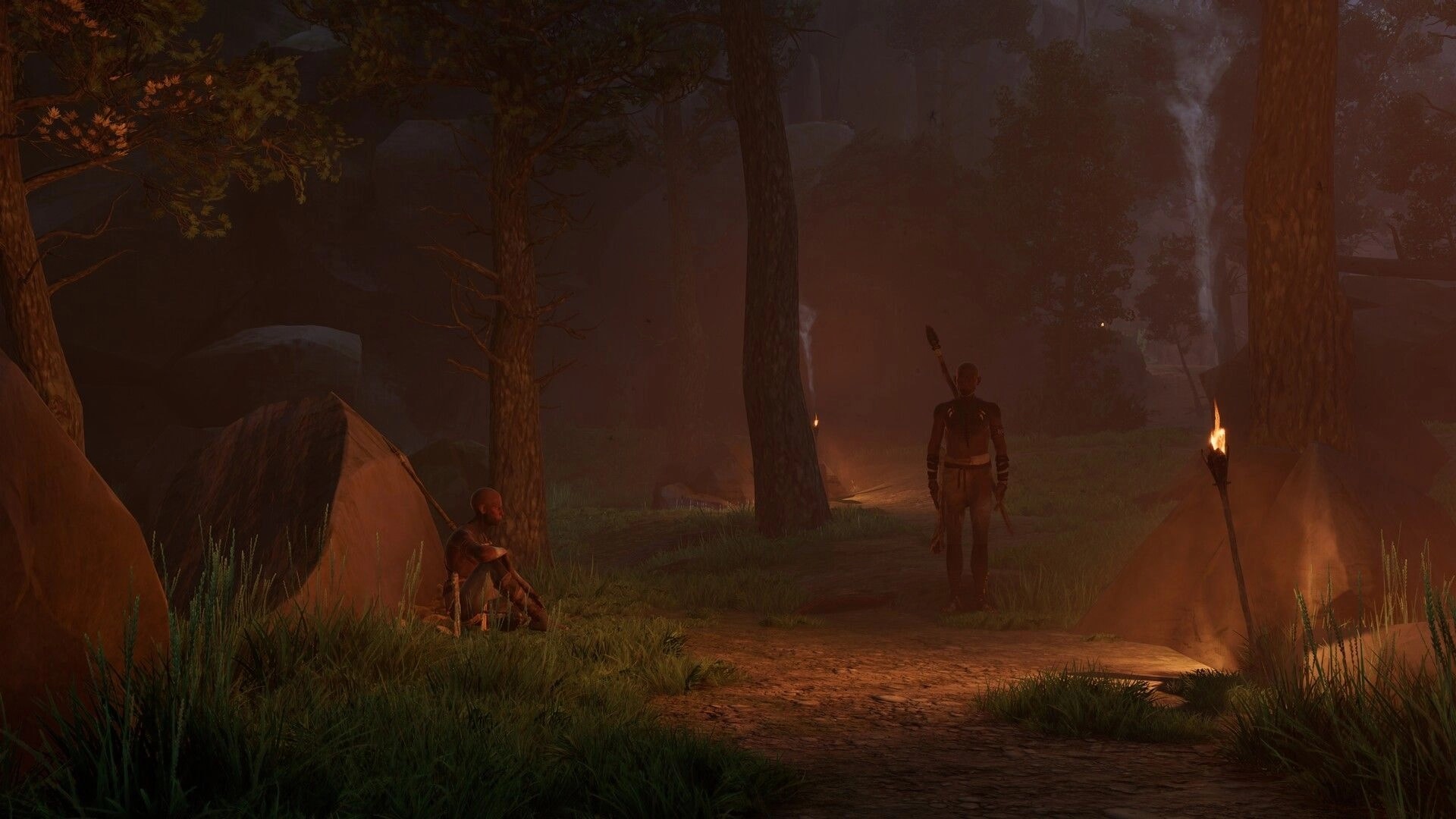 Kiipluu: Two tribesmen by a torchlit path, one seated by rocks, one standing in forest camp.
