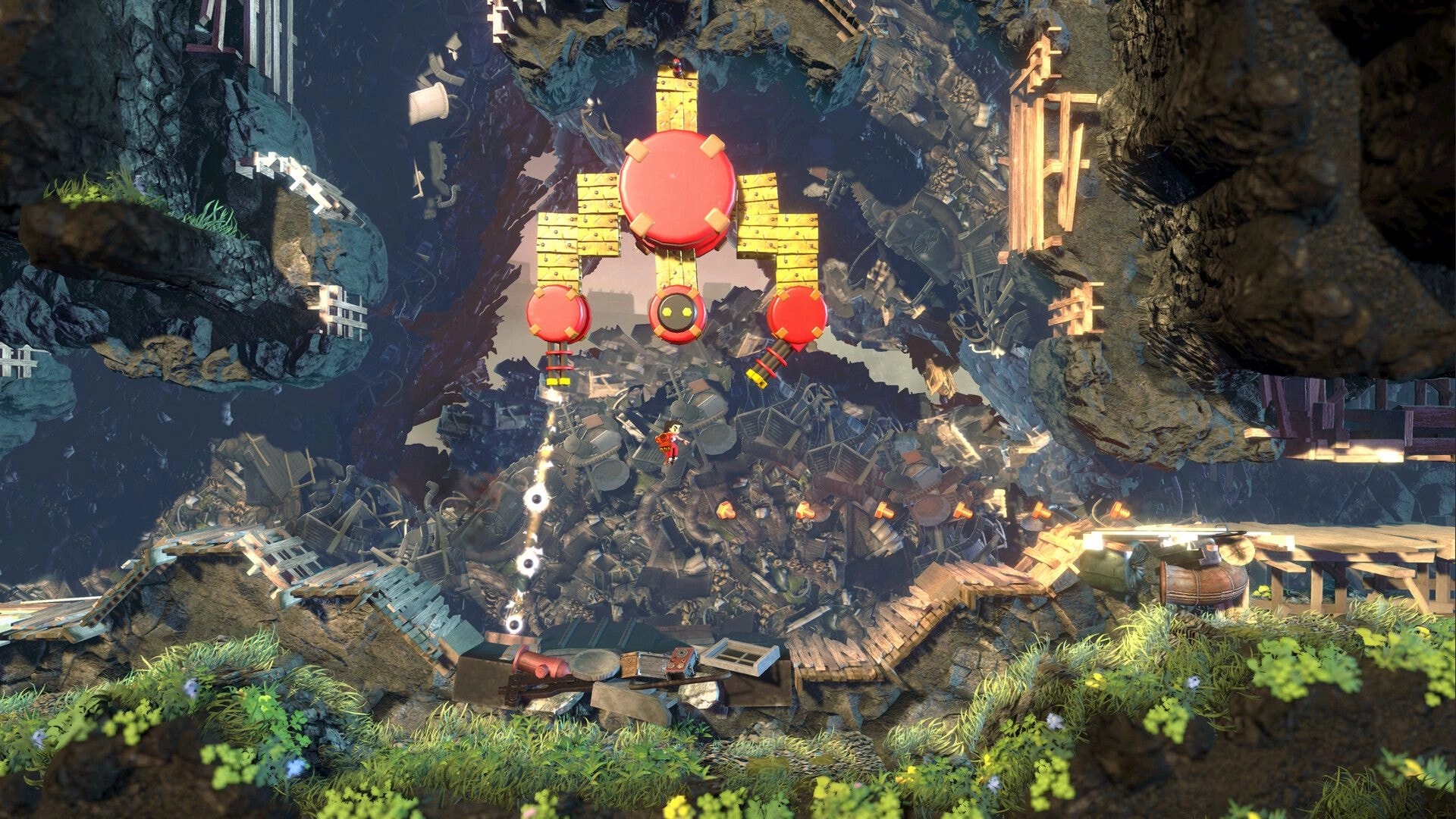 Knuckle Jet: Hero leaps under a huge red robot in a junkyard cavern with cliffs and debris platforms.