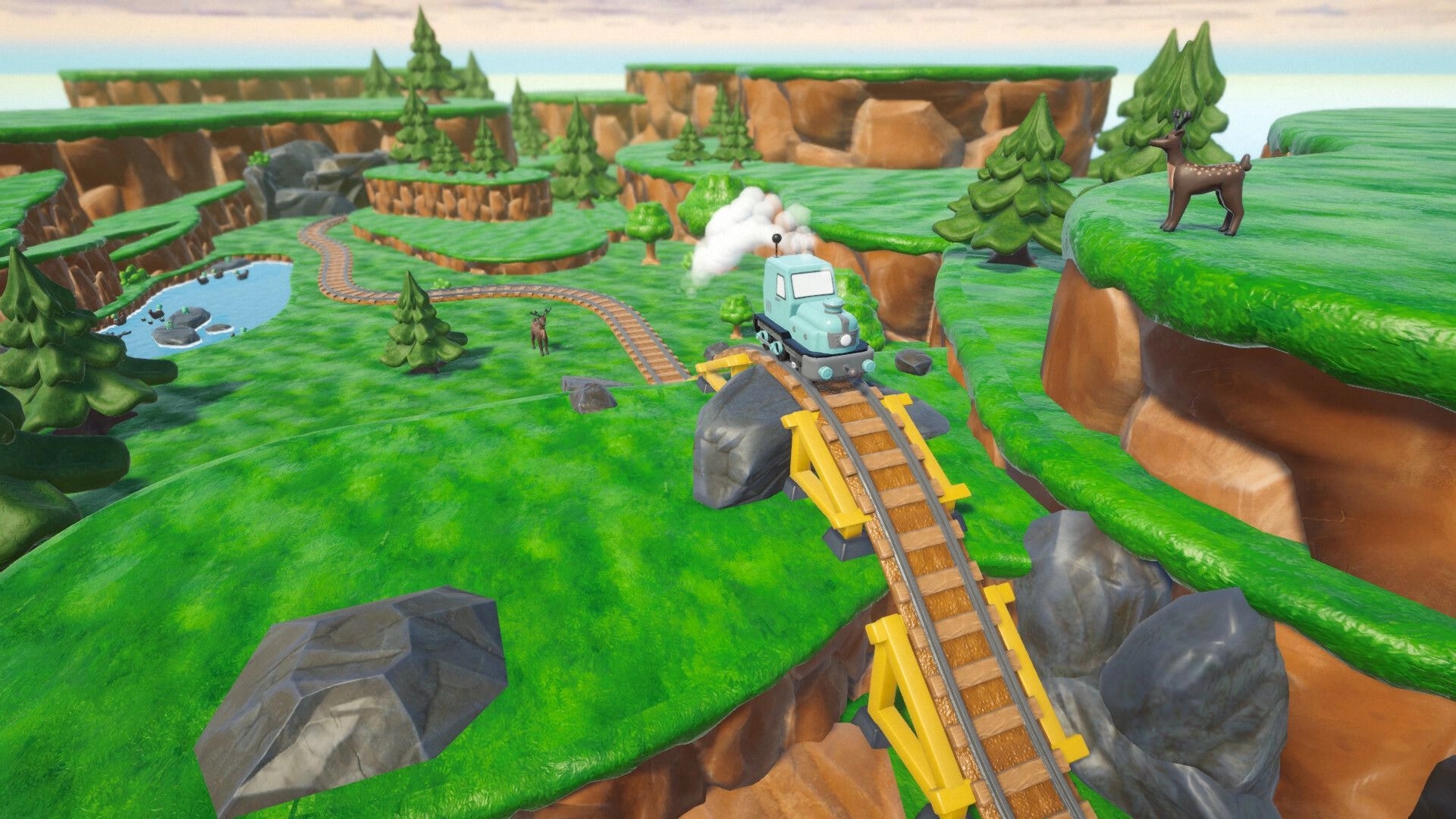 Locomochi: Blue toy locomotive climbs a steep bridge track over cliffs in a grassy valley with deer.