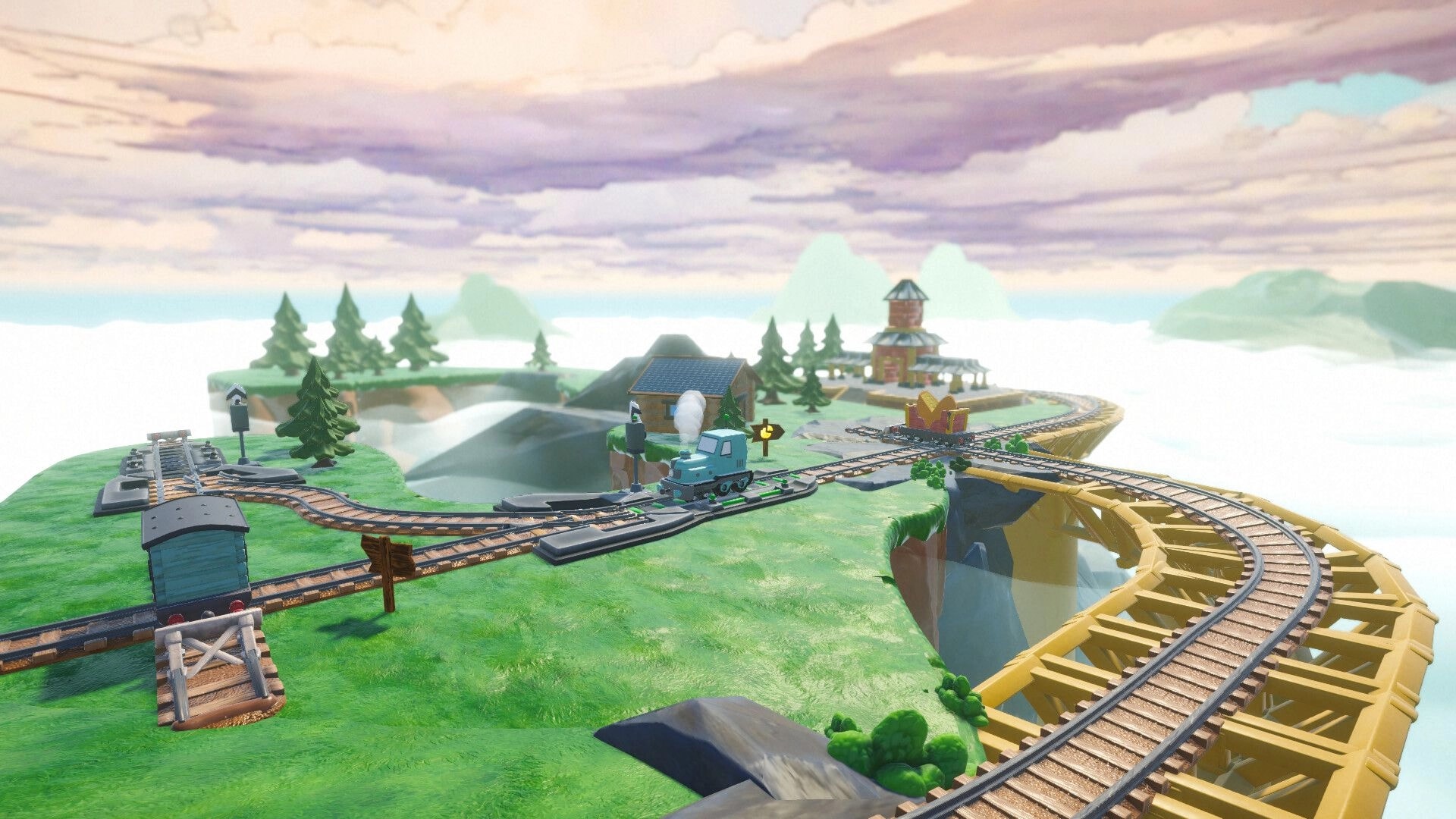 Locomochi: Blue toy locomotive at track switch by a bridge, with buildings and pine trees nearby.