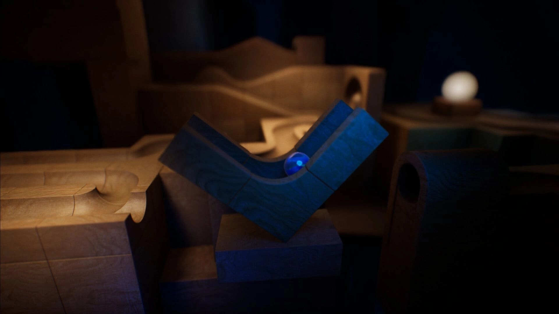 Marblearium: Blue marble rests in a blue U-shaped trough amid wooden marble-run blocks and ramps.