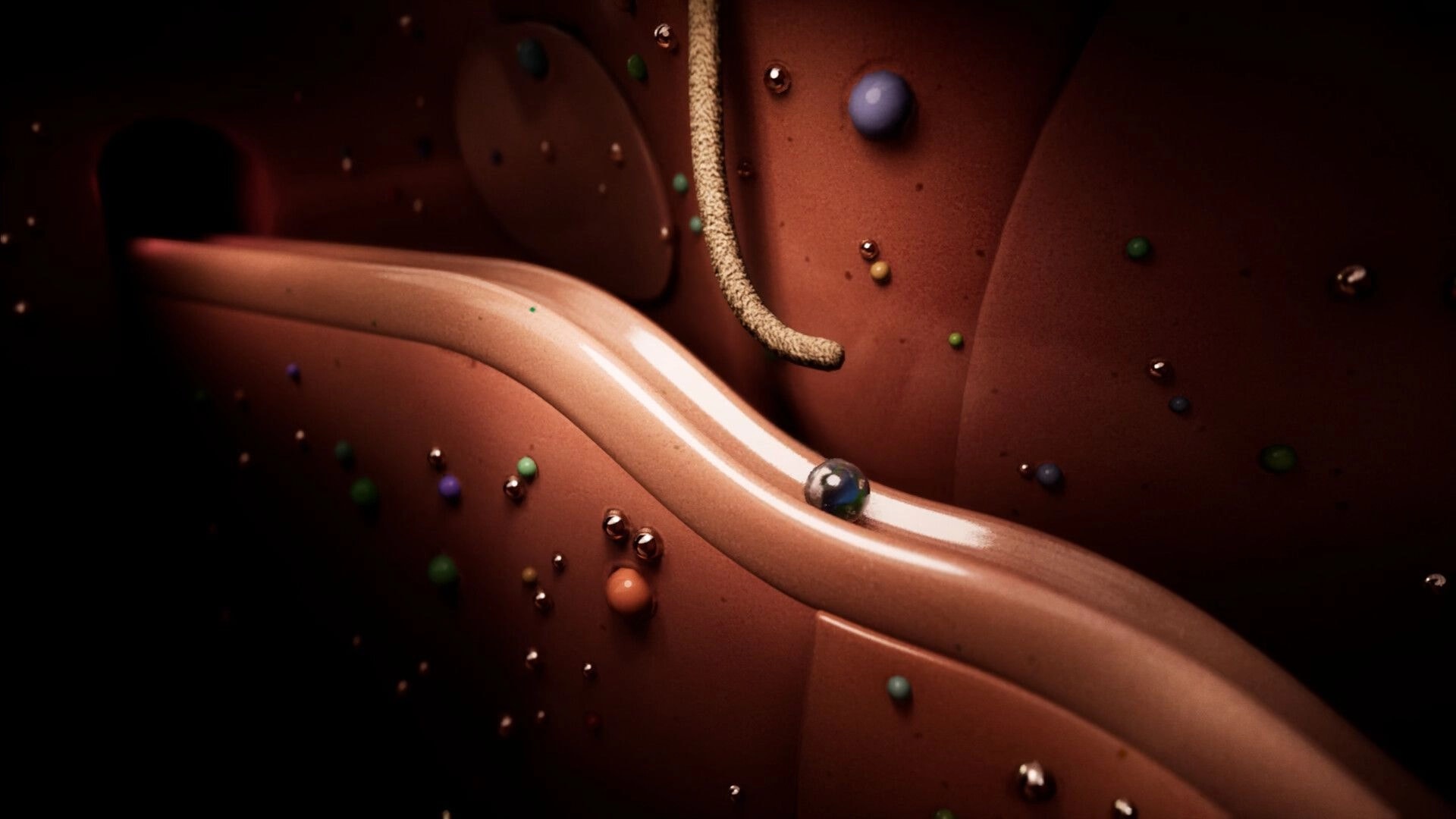 Marblearium: Marble rolling along a smooth tan track inside a reddish cavern with floating beads.