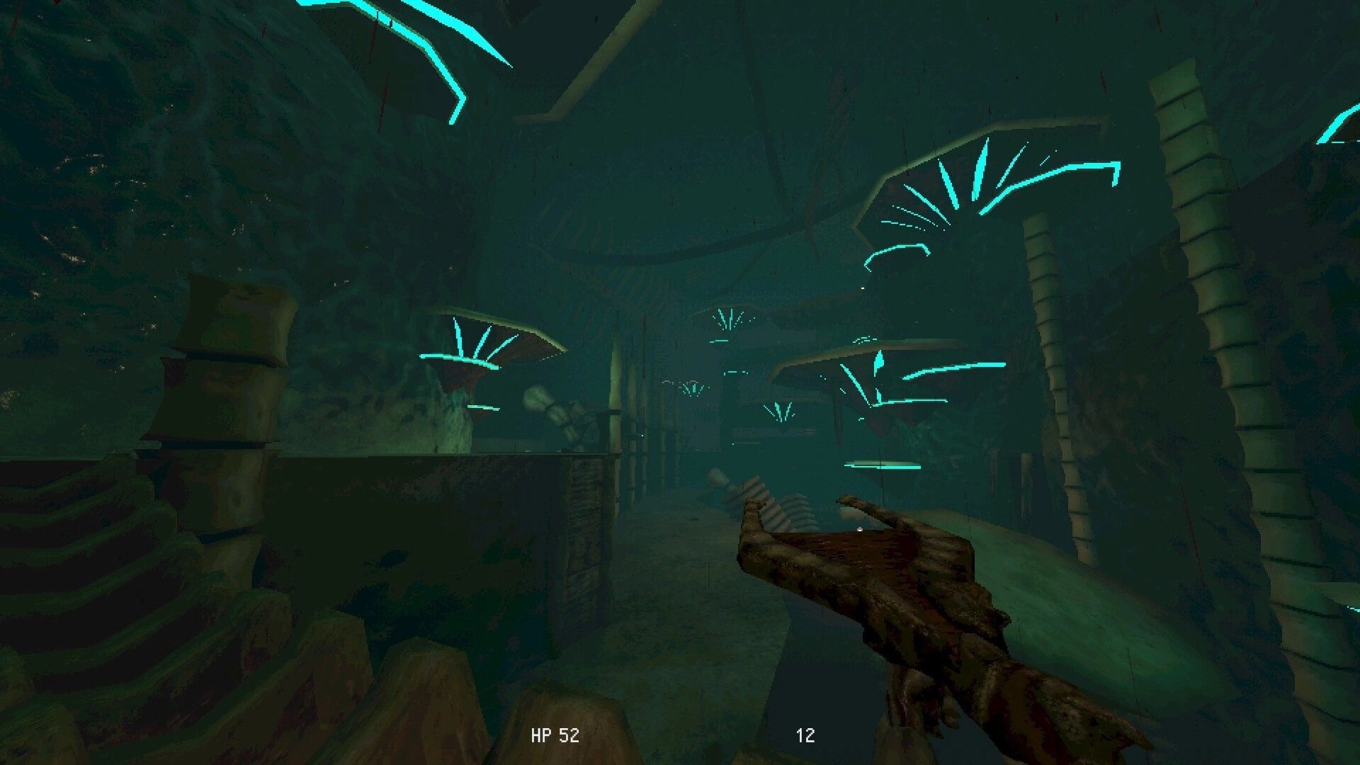Meat Engine: First-person view with clawed hand and HP 52 HUD in neon-lit organic tunnel corridor.