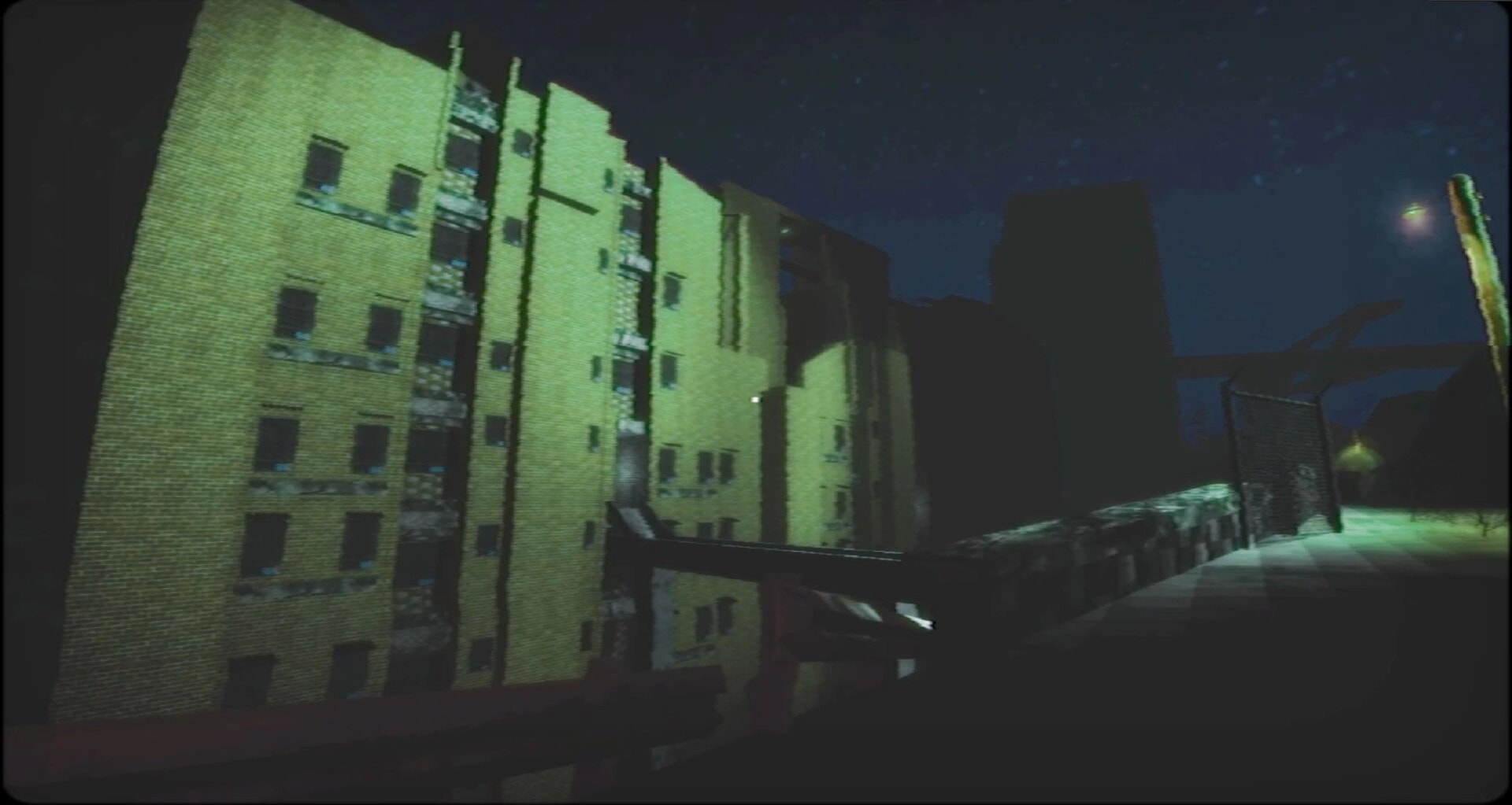 四号对象 Object 4: First-person view of an apartment block and fenced walkway at night under streetlights.