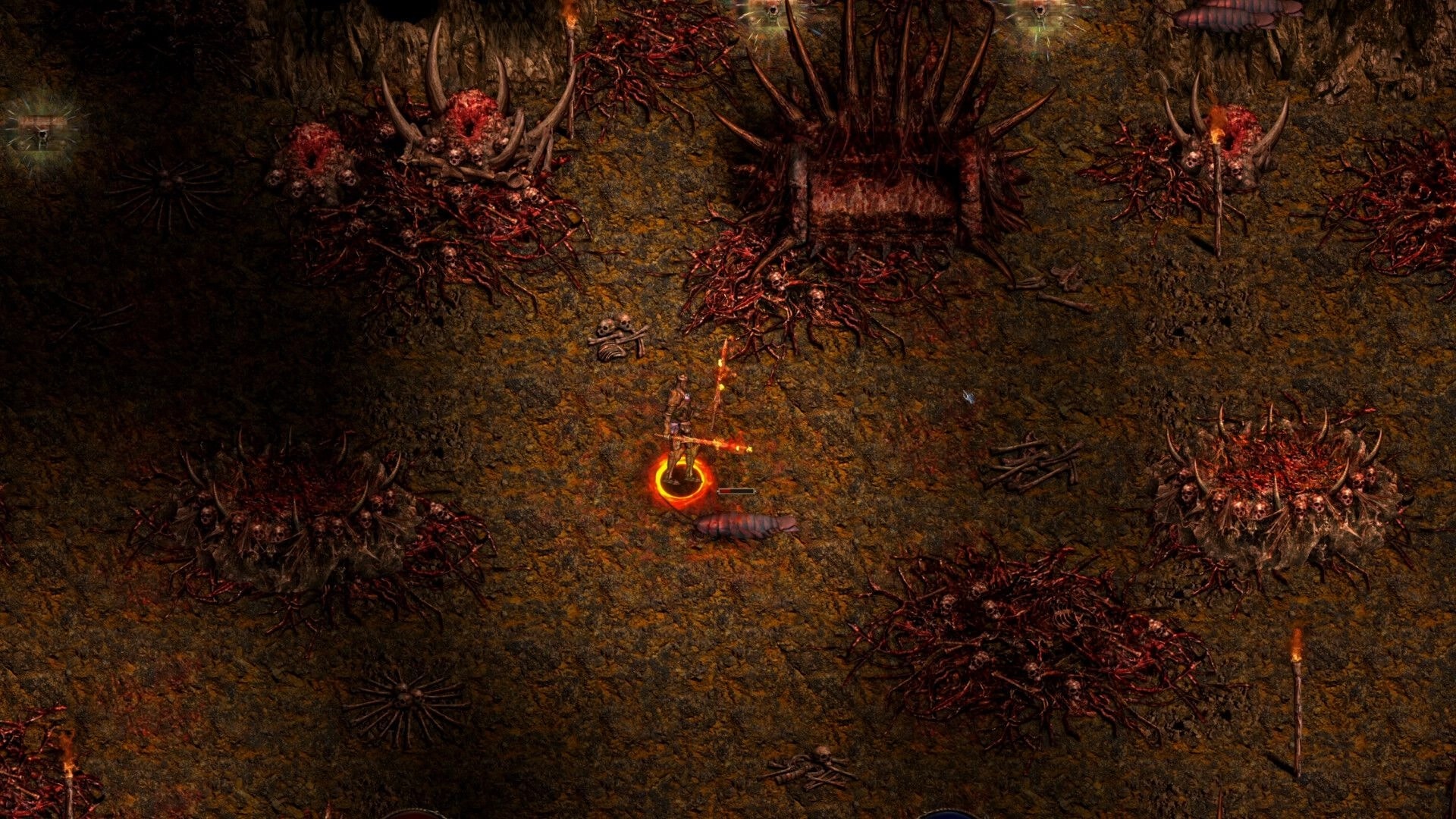 Shadow Dungeon: Hero with glowing ring aims a fiery staff in a gore-strewn cavern with skull piles.