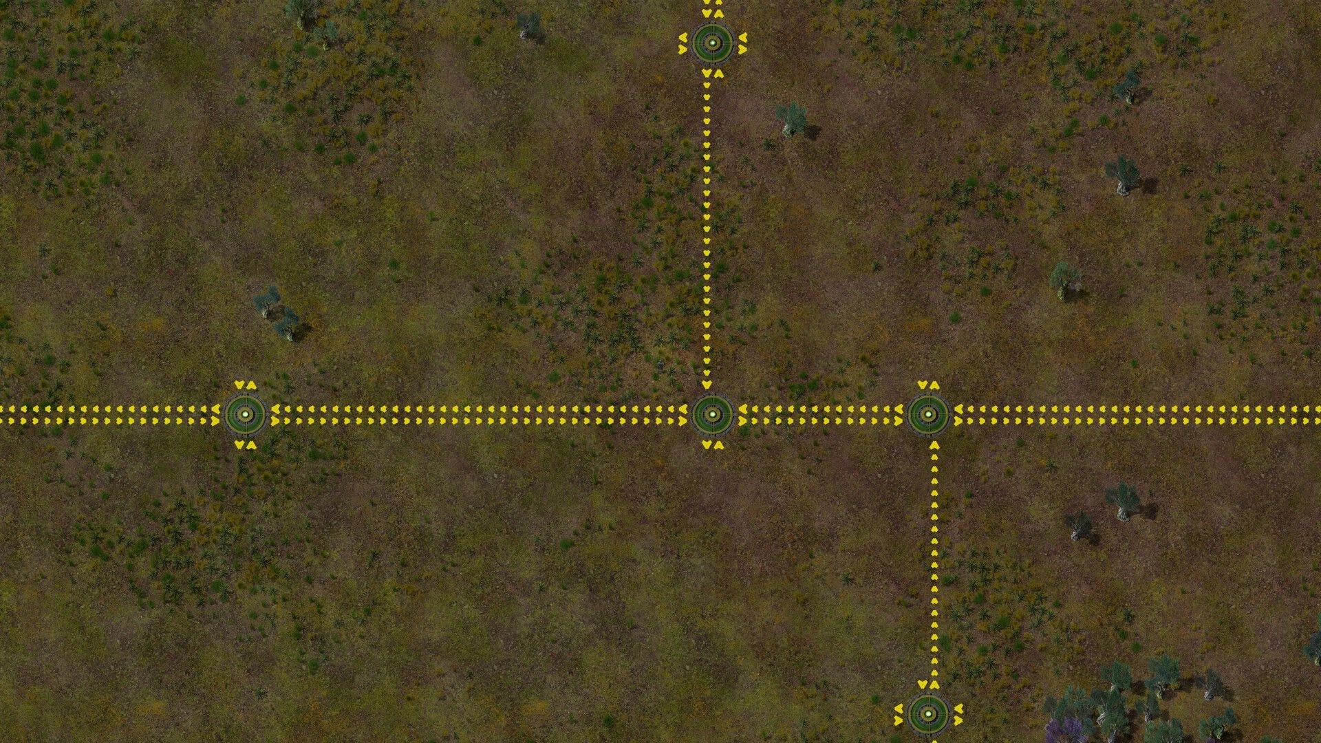 Swarmdustry: Yellow dotted conveyor paths linking circular nodes across a sparse grassy plain map.