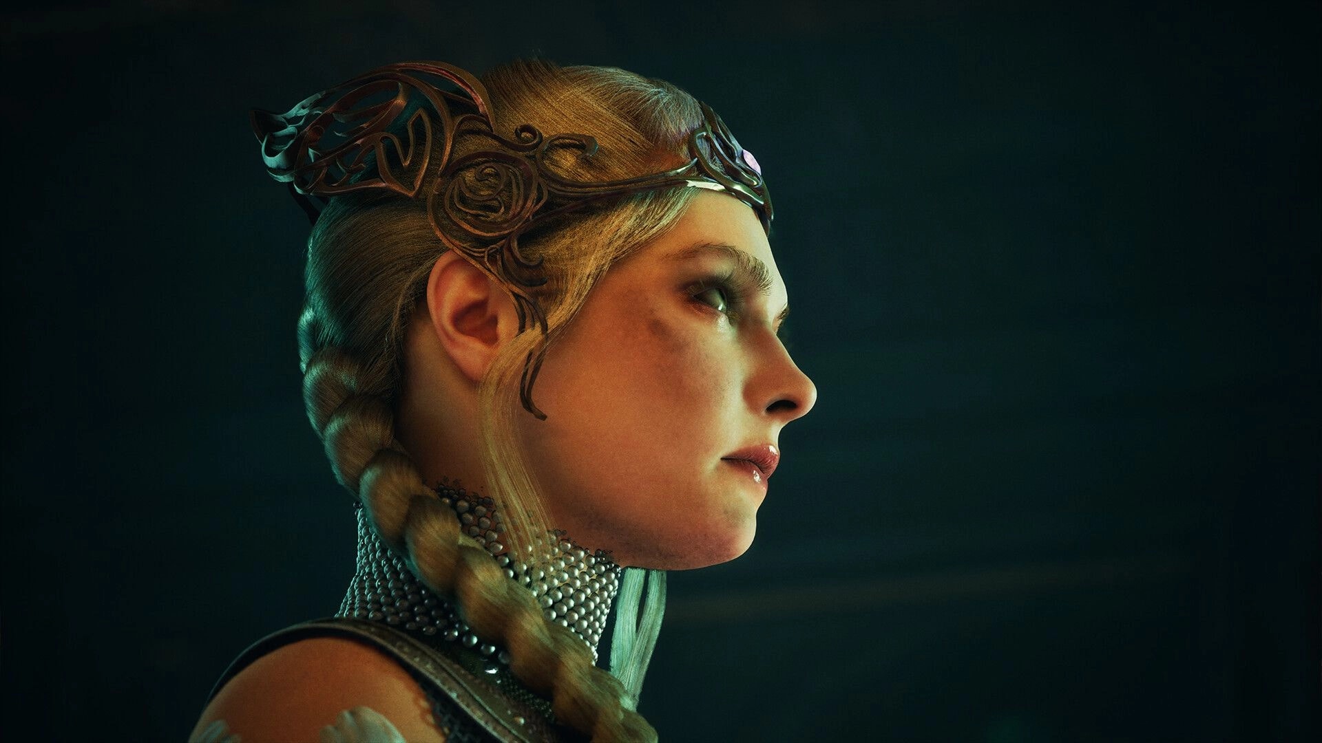 Tsarevna: Warrior princess in intricate headpiece and armor gazes intensely in dimly lit chamber.