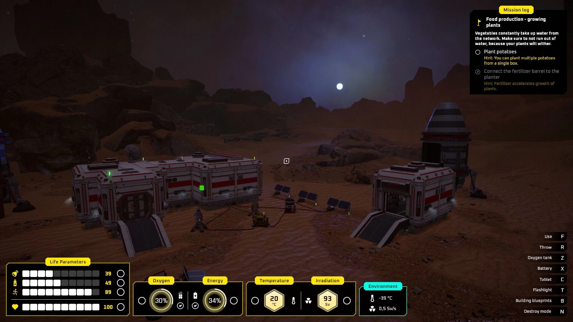 687 Days on Mars: Base building at night with life parameters and mission log in rocky Martian landscape