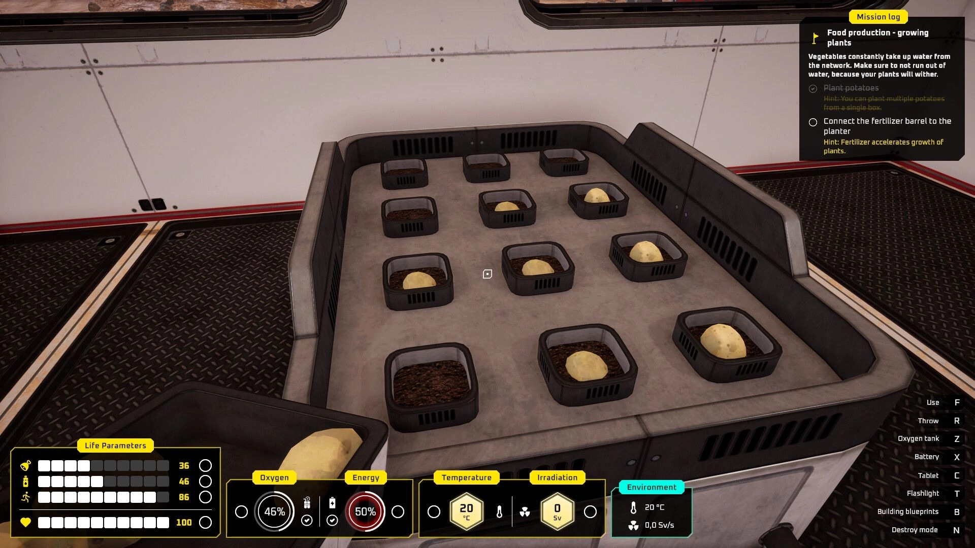 687 Days on Mars: Potato plants growing in trays inside a base module with life parameters displayed