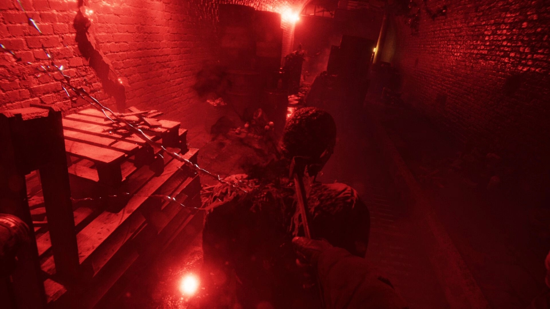 A.A.U. Black Site: Player stealthily attacks enemy with knife in dimly lit, red-hued corridor.