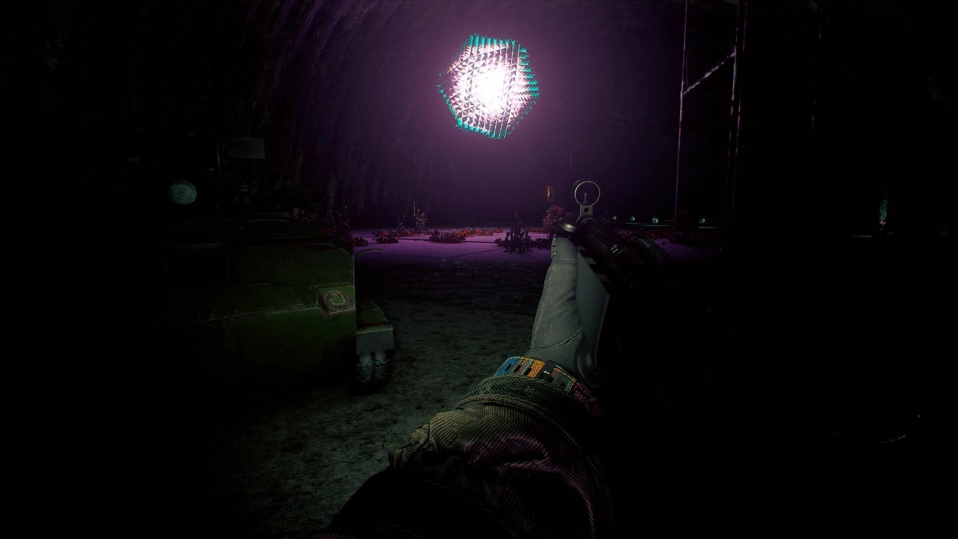 Active Matter: Player aiming weapon at glowing geometric object in dark, quantum unstable zone tunnel
