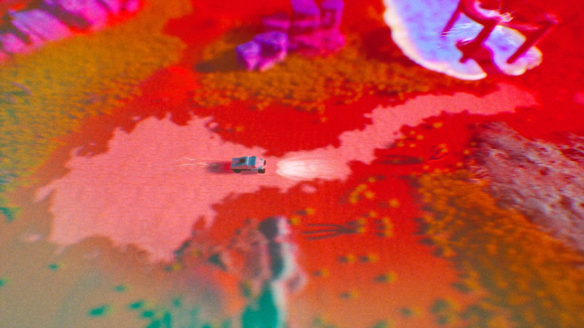 ADRIFT: Small vehicle navigating red desert terrain with colorful dunes and scattered rocks visible