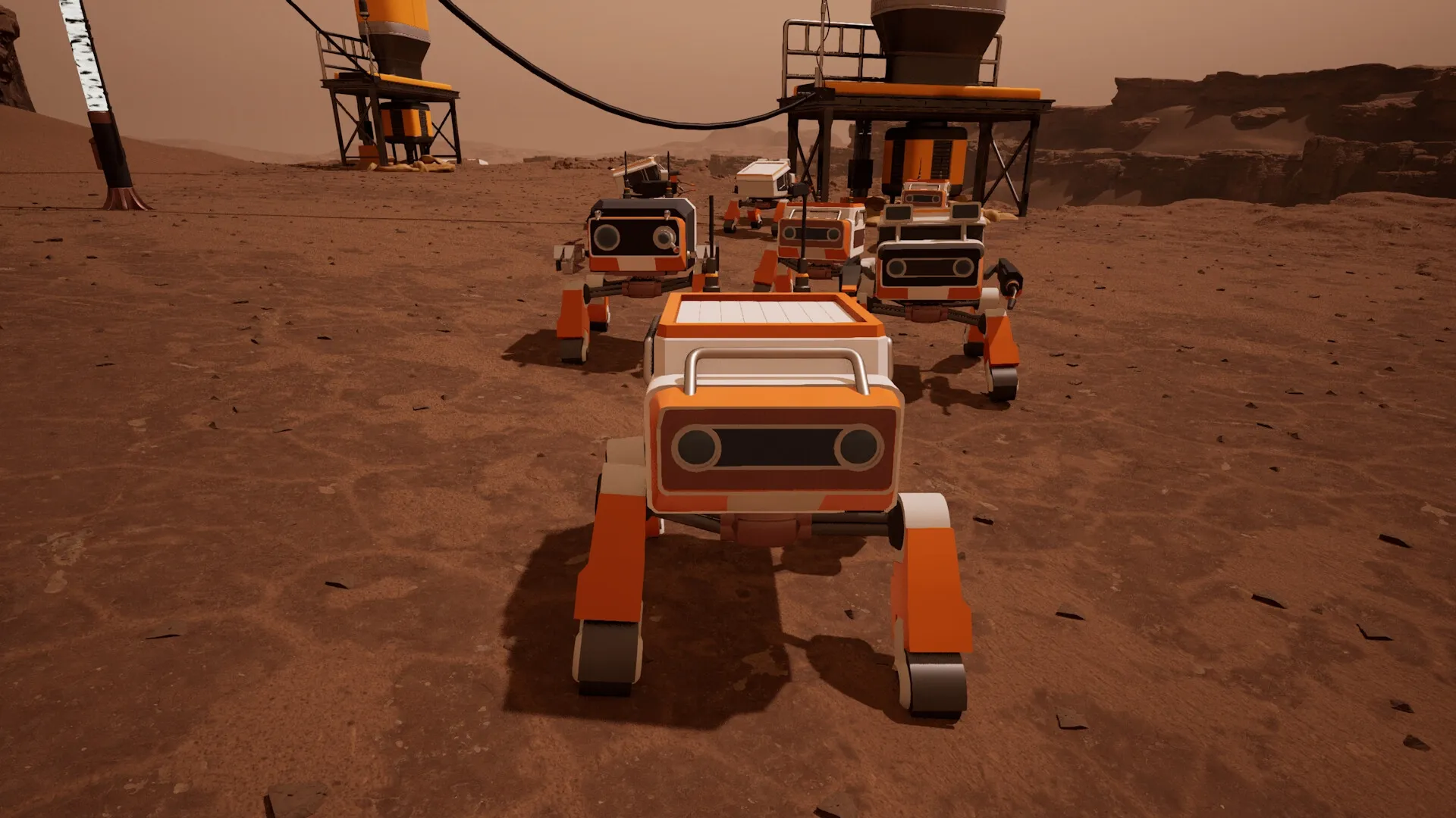 AGRONOM: Orange robots traversing Martian terrain near a mining structure with rocky cliffs in background.