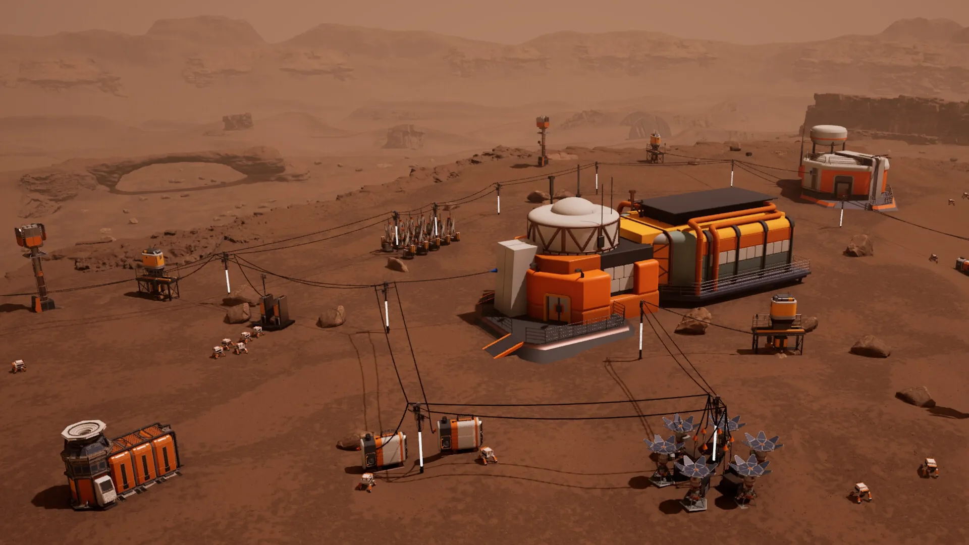 AGRONOM: Martian base overview with robotic units and structures connected by cables in a desert landscape
