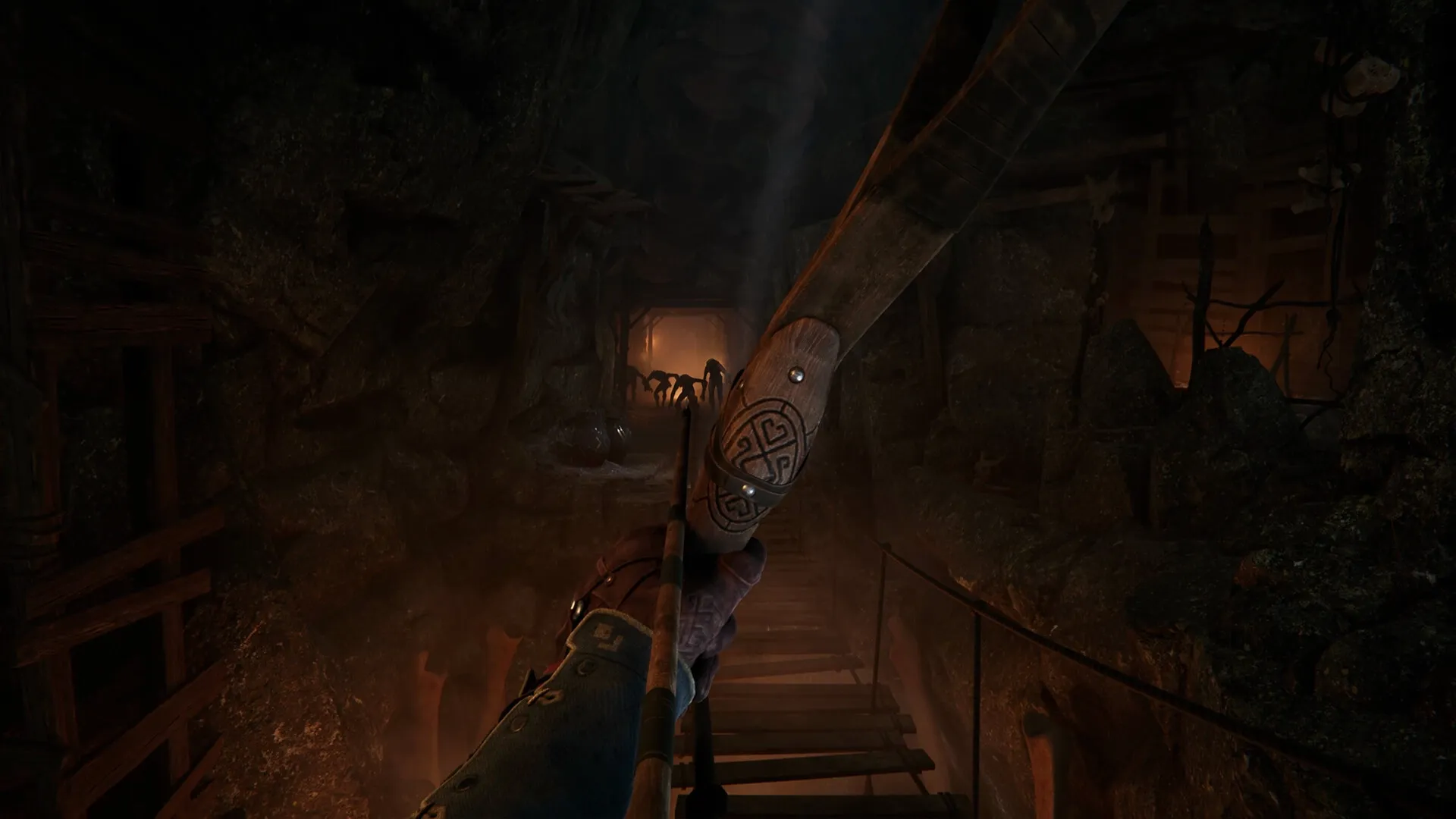 Alkahest: First-person archer aiming at shadowy figures in a dimly lit cave passage