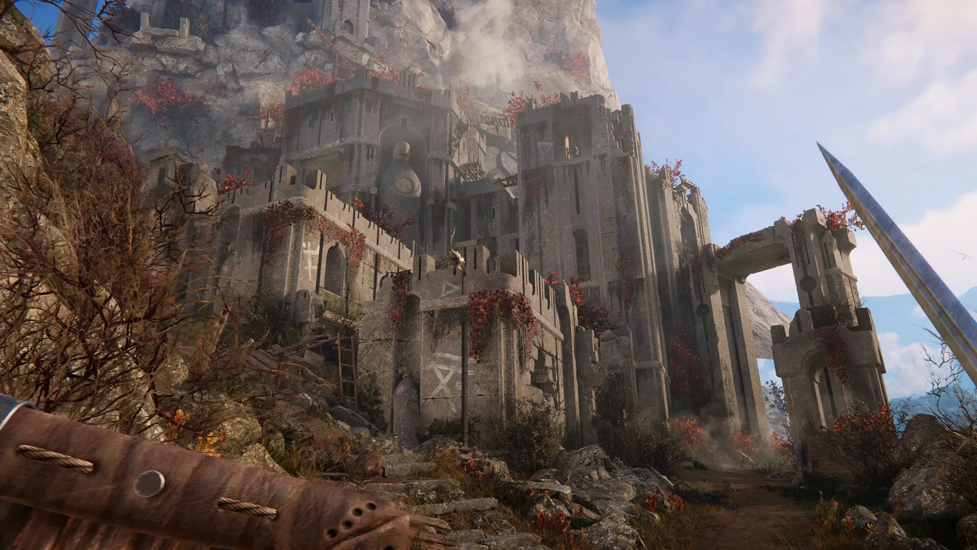 Alkahest: Ruined stone fortress with red vines in rocky landscape, sword edge visible on the right.