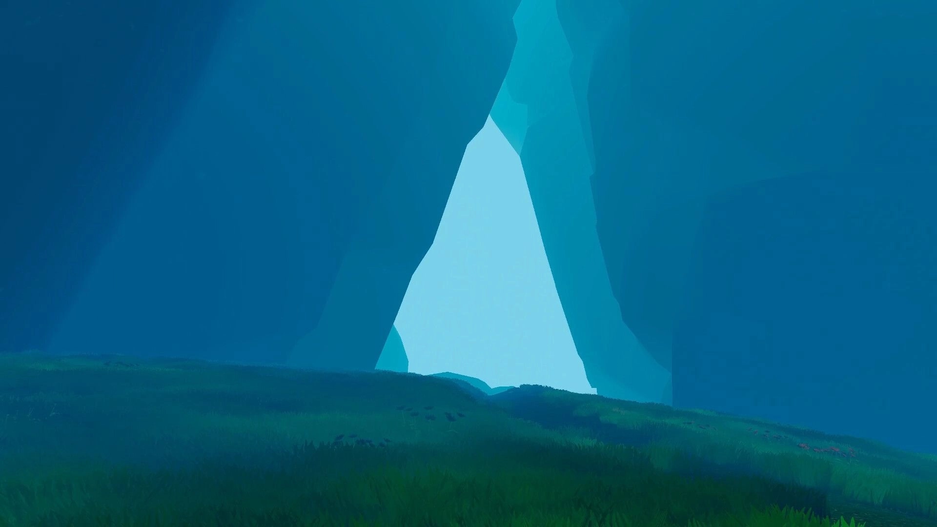 All Those Who Wander: Vast canyon opening with lush green grass under a bright, serene blue sky.