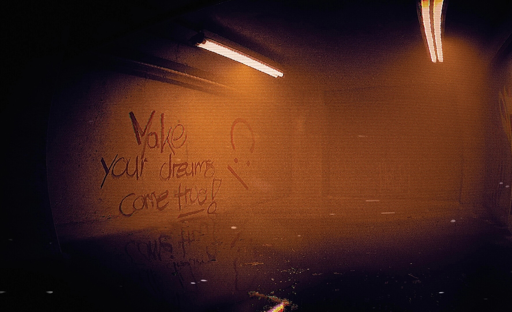 ALONE: Graffiti reading "Make your dreams come true!" on a grimy wall under flickering lights in a hall.