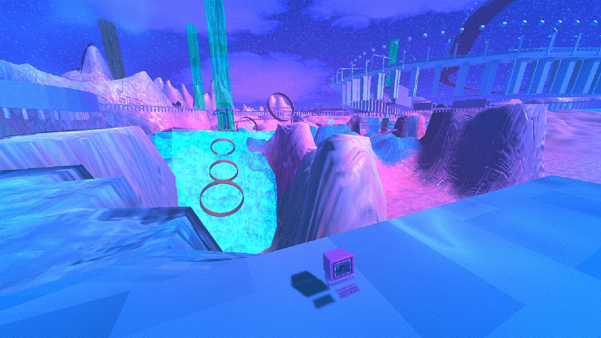 Angel: View over neon icy canyon with floating ring gates and a small computer on ledge.
