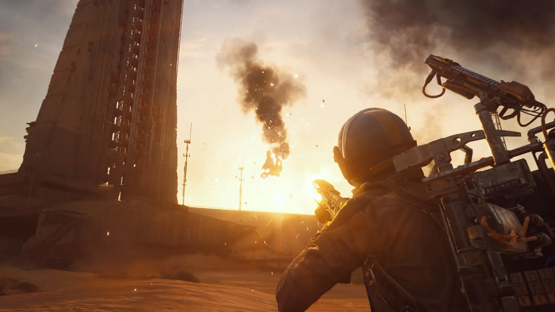 ARC Raiders: Player aims weapon at descending debris near towering structure in a sunlit desert landscape