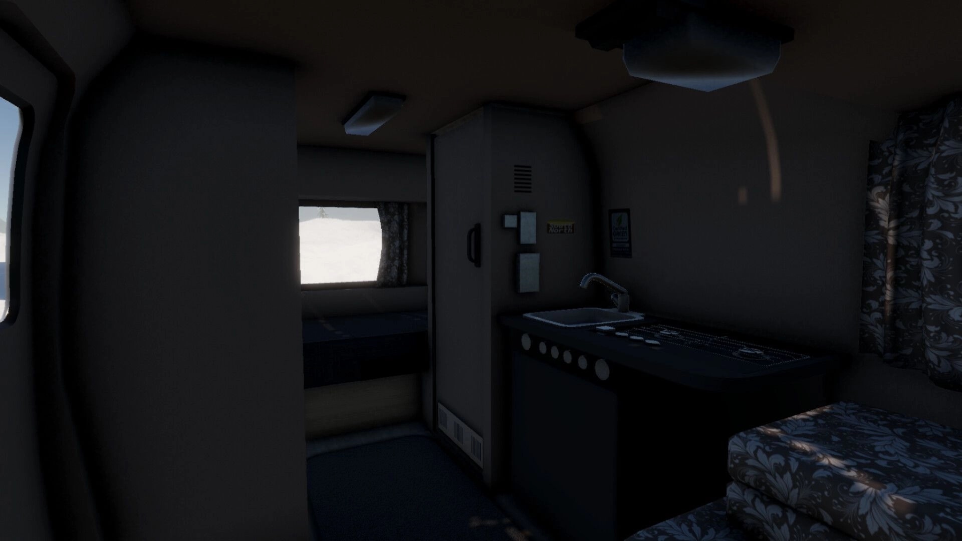 Arctic Drive: Inside camper cabin with sink, fridge, and bed, snowy landscape visible through window.
