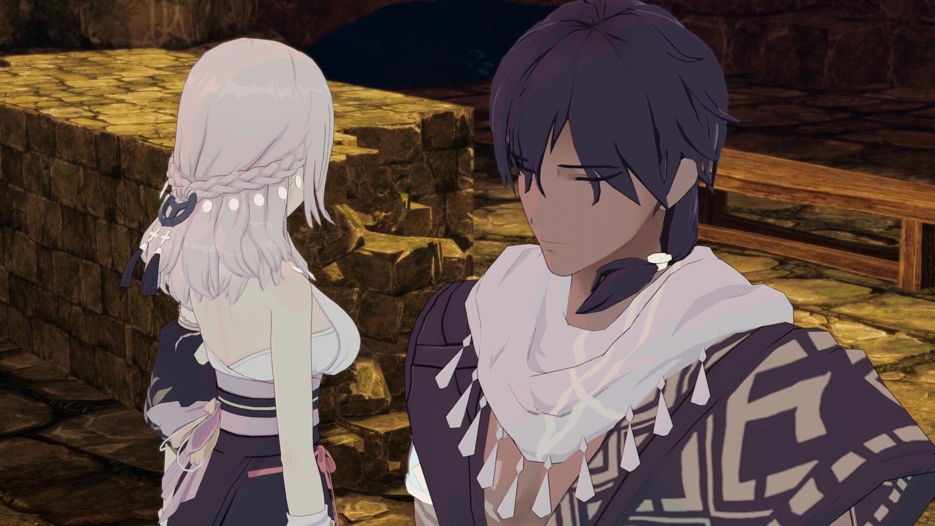 ARIE: Two characters in a close conversation, standing near a stone wall in a dimly lit environment.