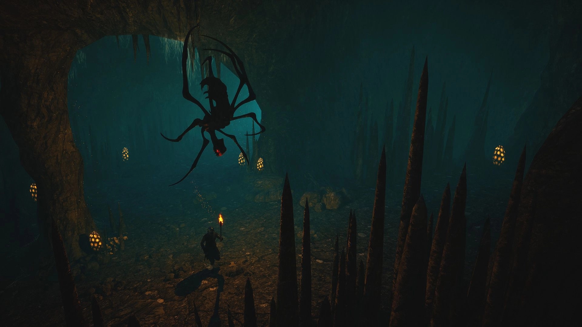 Ars Notoria: Player with torch confronts giant spider creature in dimly lit underground cave