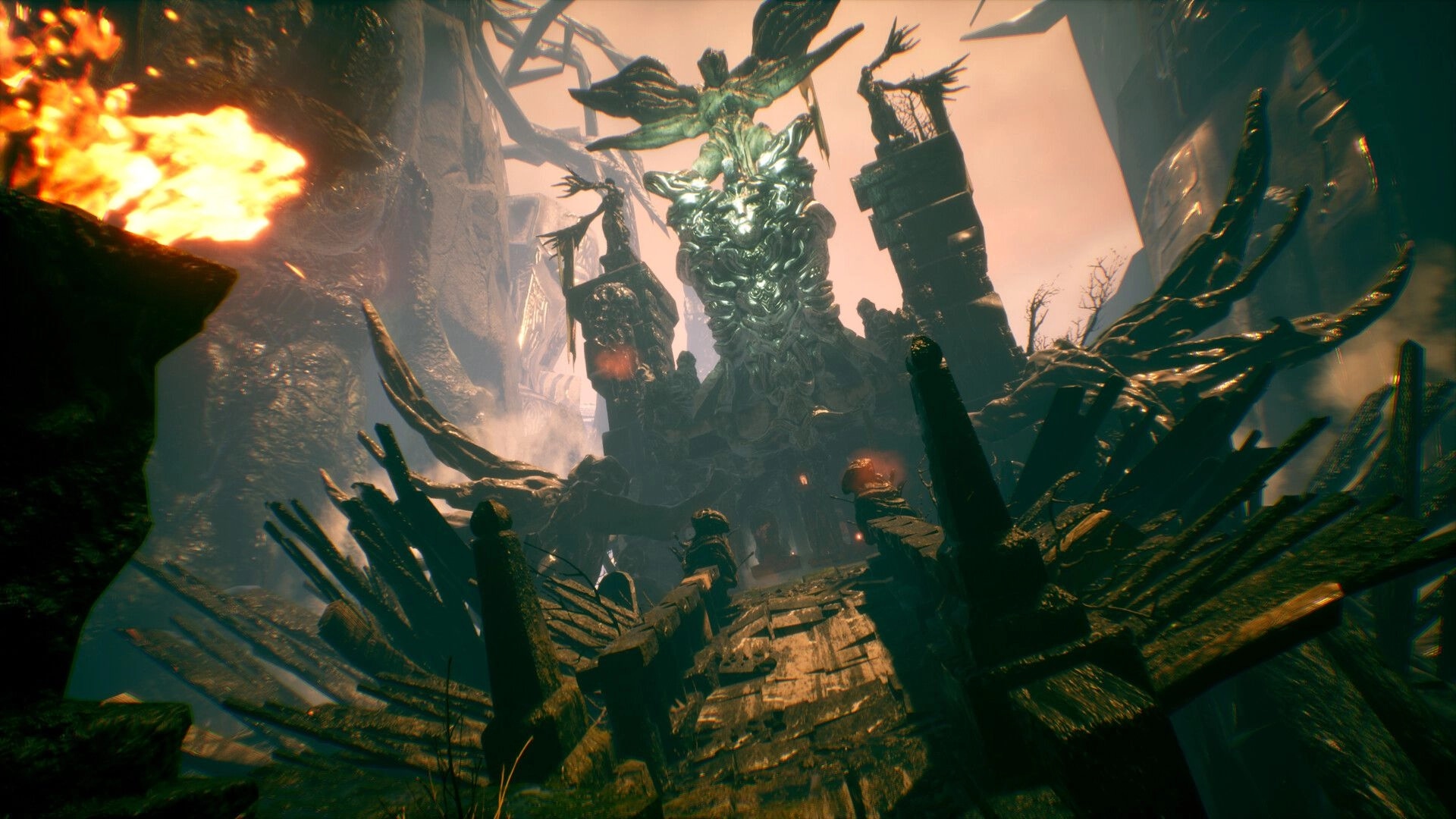 ASTHENIA: Towering twisted statue looms over a broken walkway in a ruined canyon with firelight.